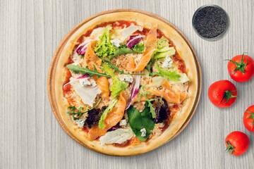 Pizza with cheese, tomato sauce and basil on table, top view