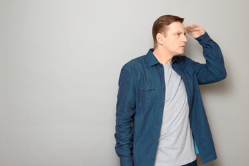 Portrait of serious focused man gazing into the distance