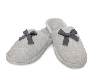 Soft cozy women's home slippers isolated on a white background. Comfortable home shoes. Hotel bath slippers