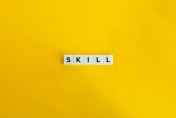Word Skill on Letter Tiles on Yellow Background. Minimal Aesthetics.