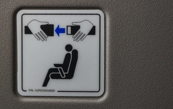 Fasten your seat belt sign in an airplane