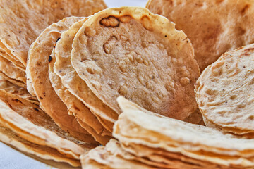 Traditionally made Mexican ceviche. Fish strips with tomato, lettuce, onion, avocado, orange.