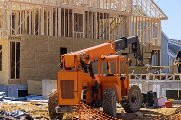 Forklift on a construction site, preparing to moving building material construction