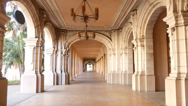 Spanish colonial revival architecture, Balboa Park, San Diego, California USA. Historic building, classic baroque or rococo romance style. Arches and columns of Casa, archway, vault, arcade or passage