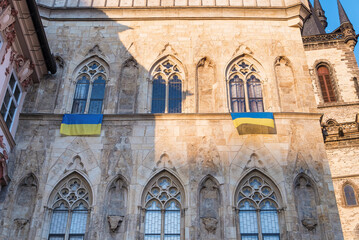 Obraz premium Prague, Czech Republic - 03.28.2022: An Ukrainian flags is hung in support of Ukrainians protecting their country from russians.