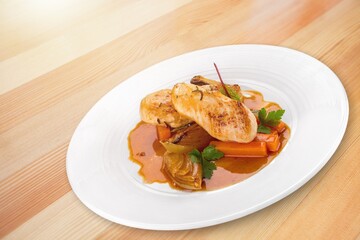 Roast chicken meat with vegetable on plate