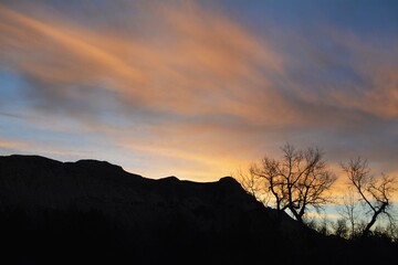 Sunrise over hilly landscape