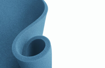spiral curved roll of blue sponge foam sheet with copy space