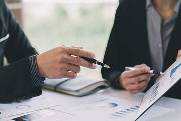Close up of working process at business meeting,Business partners discussing graph of financial,...