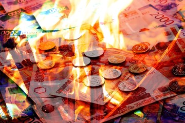 Fototapeta na wymiar Background of russian rubles with fire flames