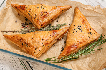 Tray with tasty Uzbek samsa on table