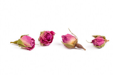 Dry rose flower petals tea on the white background