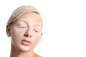 Fototapeta premium Beautiful young woman with creative makeup on white background