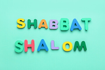 Text SHABBAT SHALOM on color background