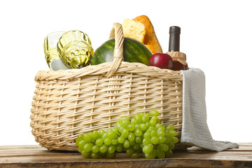 Wicker basket with tasty food for picnic on table against white background