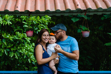 latin family, father, mother and baby girl, outdoors in nature