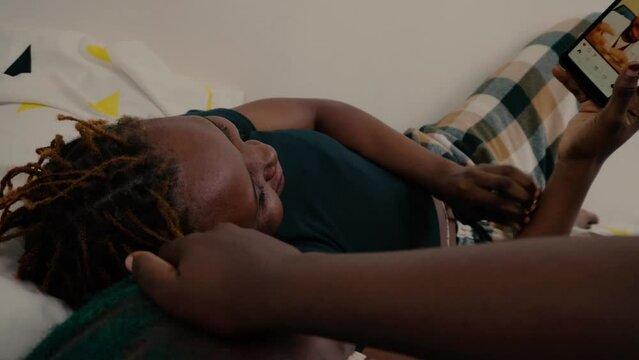 black girl watching videos on phone