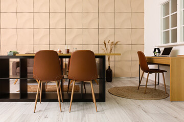 Interior of stylish dining room with modern workplace