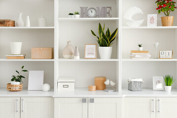 Shelf unit with beautiful decor in room - obrazy, fototapety, plakaty