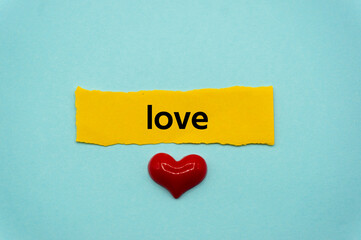 love.The word is written on a slip of paper. Emotional nouns, feeling words, emotional phrases....