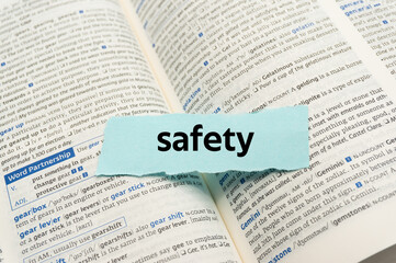 Obraz premium safety.The word is written on a slip of paper. Emotional nouns, feeling words, emotional phrases. Positive or negative attitudes.
