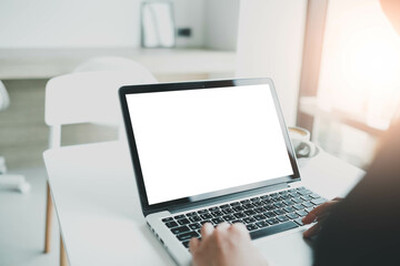 mockup image computer,cell phone blank screen for hand typing text,using laptop contact business searching information in workplace on desk at office.design creative work space on wooden desk.