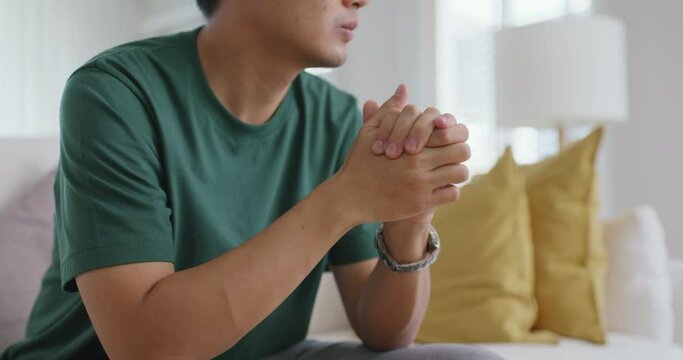 Asia people young man upset head in hands think concern of job loss being fired sit at home sofa. Cancer patient worry fear pain in hard time crisis bad news. Lonely student pensive tired, sad regret.
