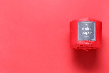 Toilet paper roll on red background