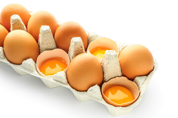 Holder with fresh chicken eggs on white background, closeup