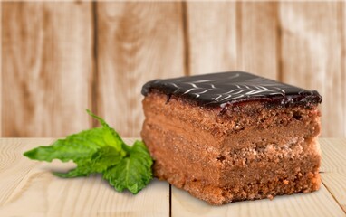Tasty sweet cake on a wooden desk