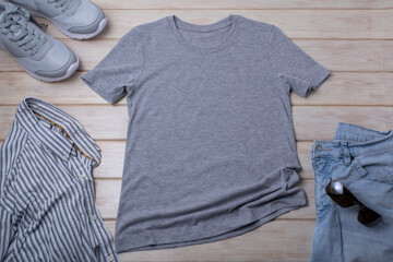 Gray T-shirt mockup with sunglasses and blue jeans