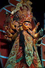 Goddess Durga idol , Durga Puja festival at night. Shot under colored light at Howrah, West Bengal, India.