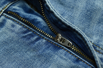 metallic zip on blue jeans