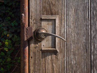 Rustic old wooden door hinge in rural style.