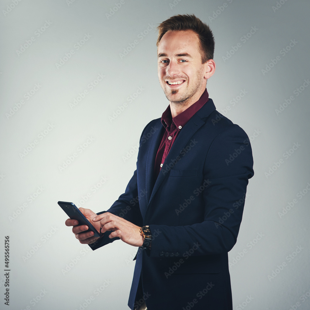 Poster call me and connect with the best. studio portrait of a confident young businessman using a mobile p