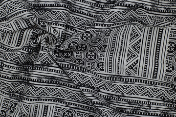 Black and white cotton fabric with Thai pattern, crumpled
nativeThai style, It is popularly worn by women in Thai traditions.
 background