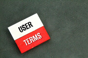 wooden board with the words User Terms