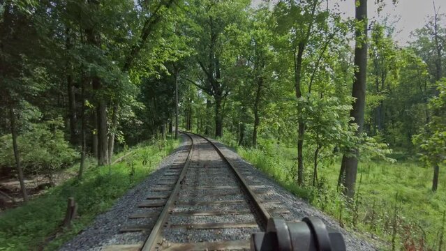 A Front of a Steam Engine View, From the Cow Catcher as the Locomotive Slowly Backs Up With Steam Blowing All Around on a Summer Day
