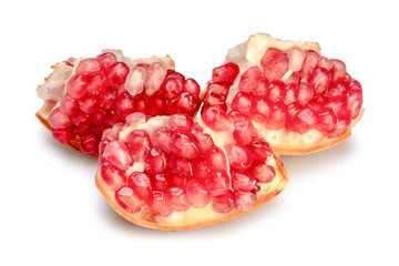 Fresh juicy pomegranate in cut pieces isolated on white background. Clipping path.