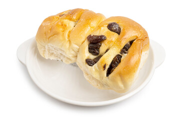 Freshly Baked Raisin Buns serving on white plate isolated on white background with clipping path	
