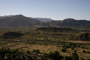 View of the green valley and hills a sunset. 