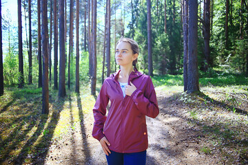 spring forest female windbreaker trekking, springtime rest nature landscape background woman tourist © kichigin19