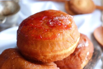 Cream filled jam donuts. garnished with sugar crystals. Traditional German Polish Donut with Raspberry Jam Dusted with Sugar.