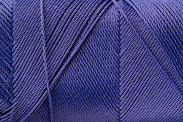 Macro texture of luxurious purple silk thread, close-up, copy space. Macro Photography of a coil...