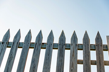 Wooden fence against blue sky