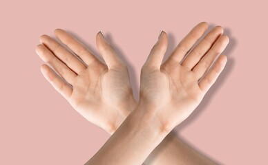 Symbol of woman's international day. Human with crossed arms shows solidarity and support for women's day 2022 concept.