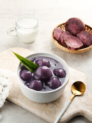 Bubur candil or Candil porridge is porridge made from purple sweet potato cooked with coconut milk, sugar and pandan leaves, tastes is sweet and delicious. Selective focus image
