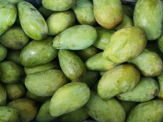 Lot of mango fruits on the local market for sale.