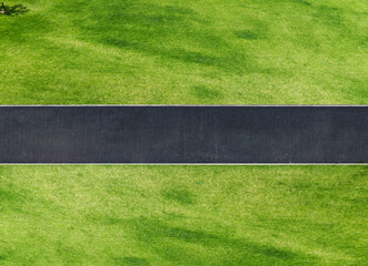 Overlooking an asphalt road across the green lawn