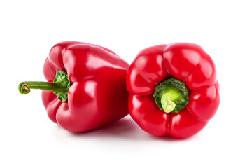 Red ripe bell peppers, isolated on white background.